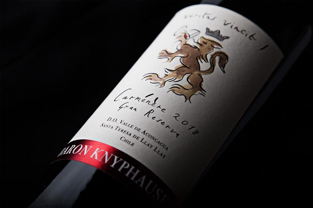 Close-up of a Baron Knyphausen Carménère 2018 Gran Reserva wine bottle, featuring an elegant label with a heraldic lion design and a red foil accent.